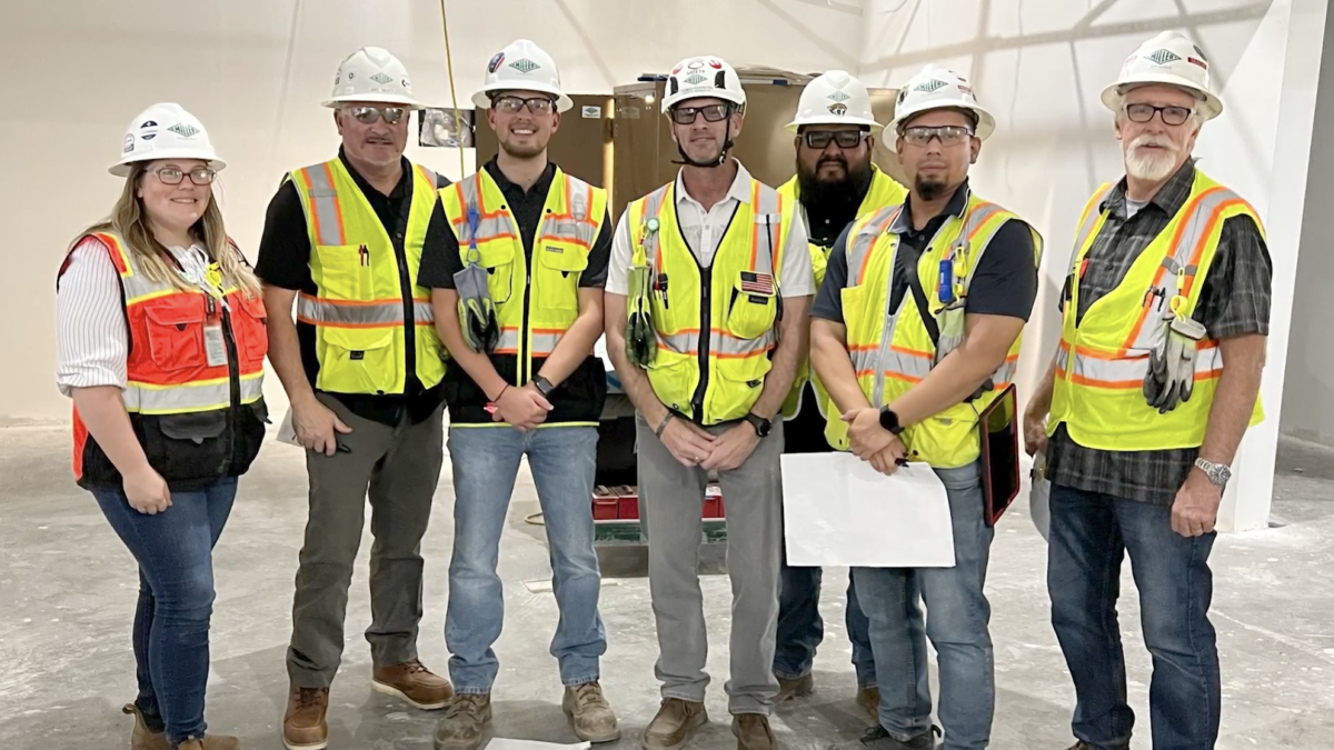 Group of military workers in PPE that work for Miller Electric Company