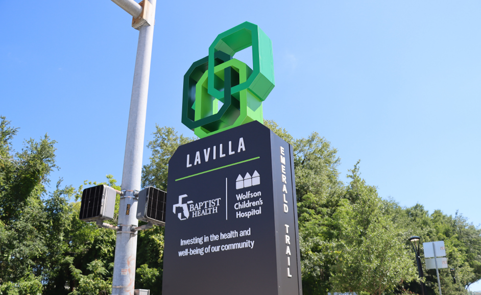 Signage for the Emerald Trail that connects near an intersection