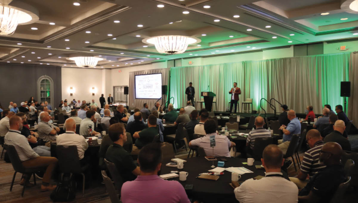 Stage with speakers at Summit