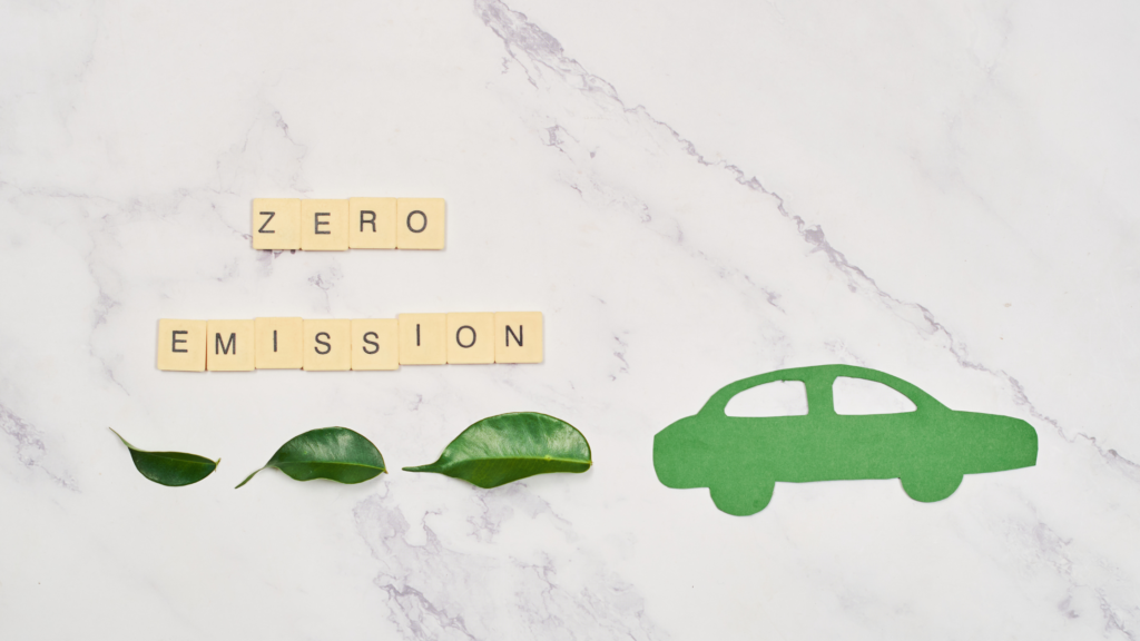 Graphic of a car with leafs behind it that says Zero Emissions