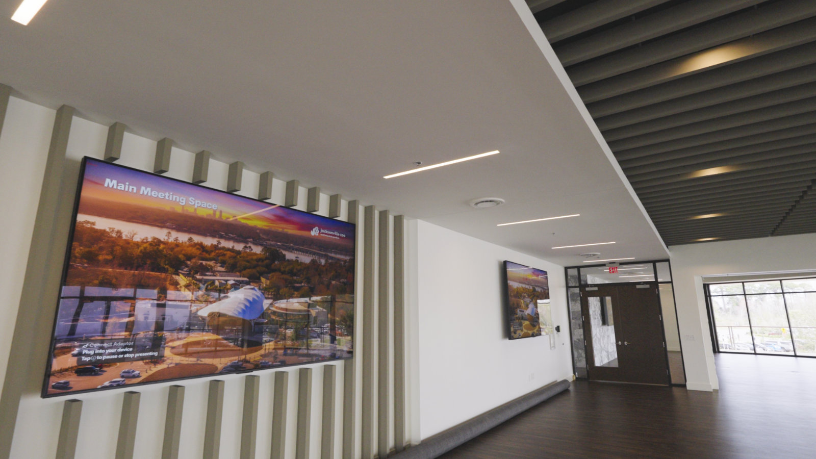 Gallery wall featuring sleek displays and lighting.