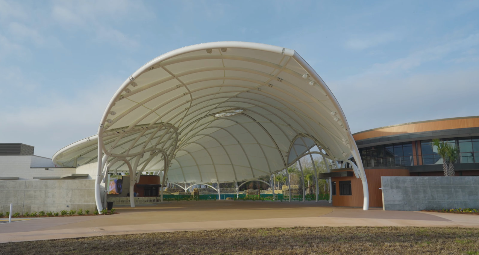 Large outdoor arched canopy in white with curves and points.