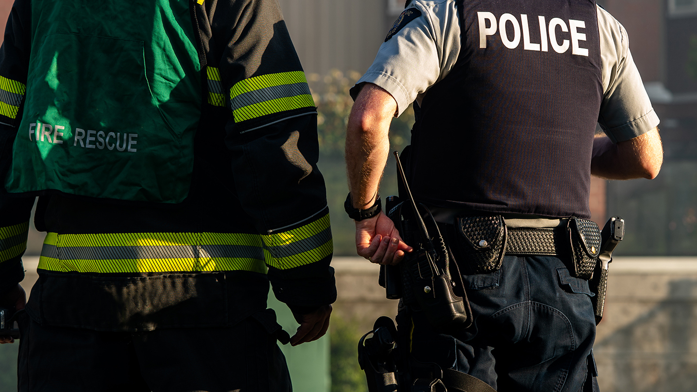 Close up view of back of Police Officer using a radio