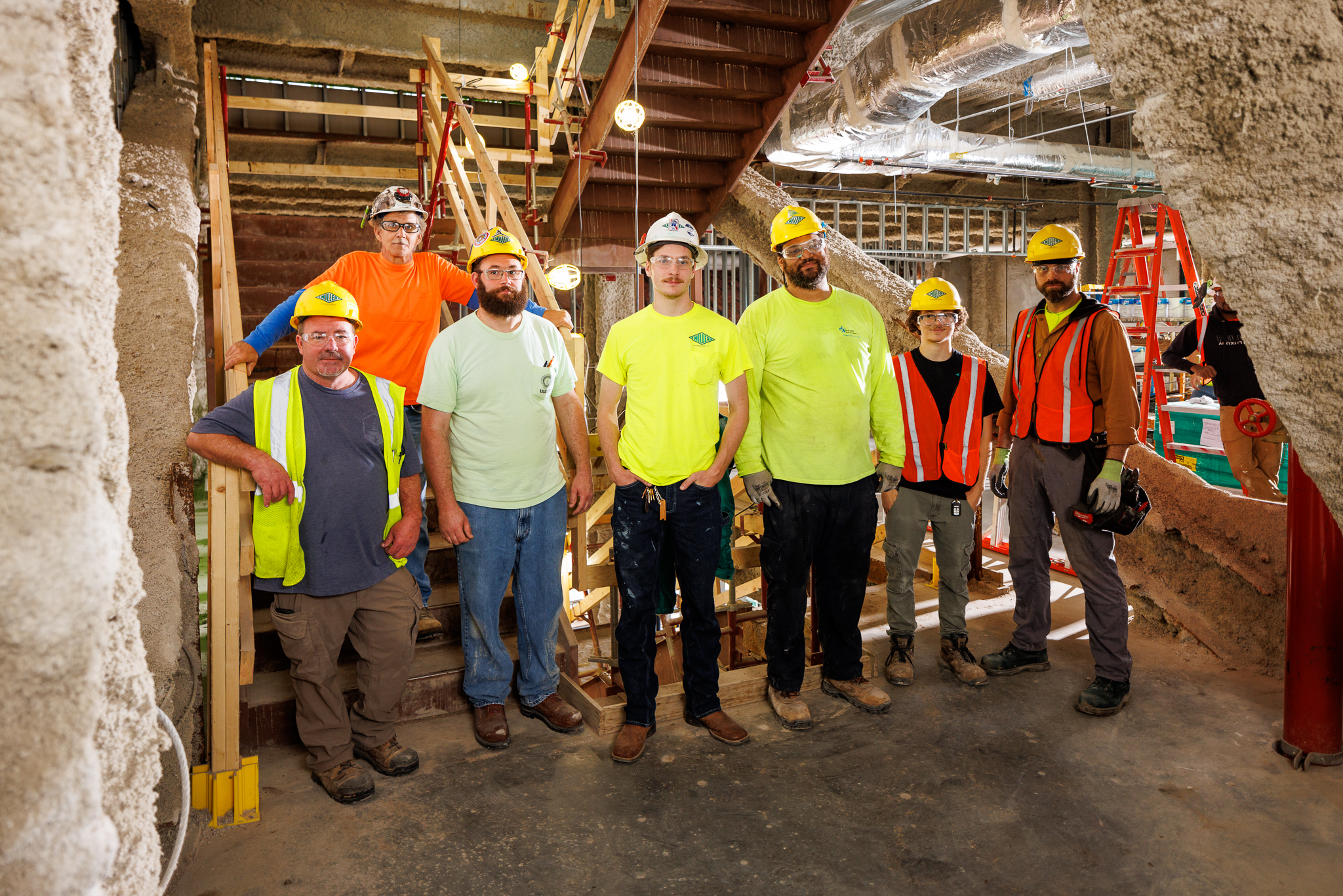 Crew poses for picture in worksite