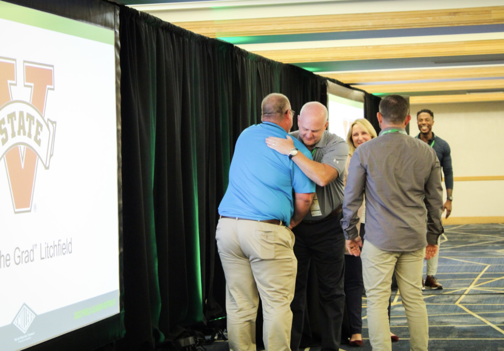 Two people hugging during the leadership retreat