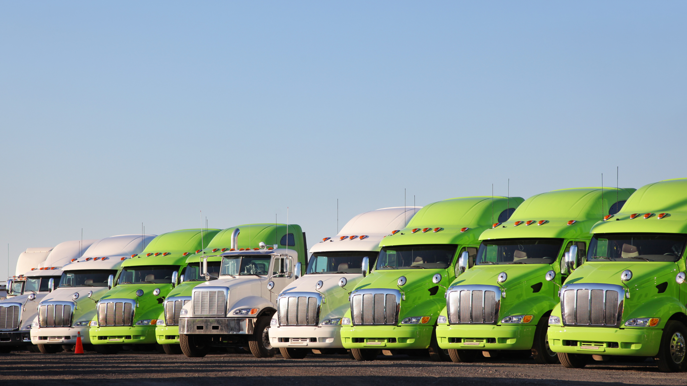 Semi trucks parked along a highway